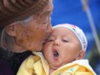 Old woman kisses her grandson who survived from the earthquake