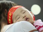 Baby fans watch Beijing Games